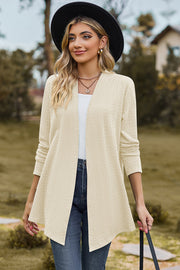 Cream textured open-front drape cardigan with long sleeves and a relaxed fit.