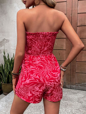 Smocked bandeau romper in strawberry print with tie detail.