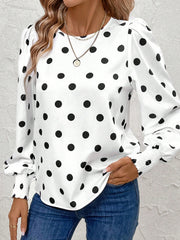 White polka dot blouse with smocked cuffs and puff sleeves