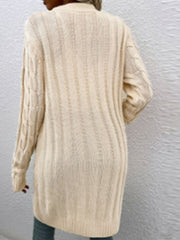 Tan cable knit button-down cardigan with textured pattern.