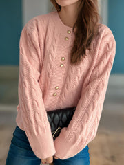 Dusty Pink cable knit cardigan with puff sleeves and gold buttons.