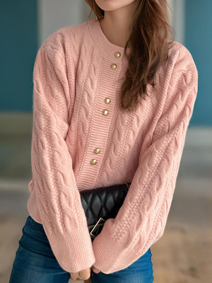 Dusty Pink cable knit cardigan with puff sleeves and gold buttons.