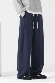 Dark blue wide-leg lounge sweatpants with drawstring and pockets.