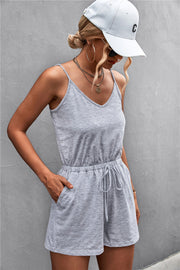 Slinky V-neck drawstring romper in Gray Dawn with adjustable waist and pockets.