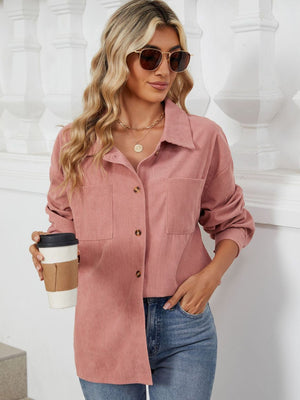 Pink corduroy overshirt with buttoned patch pockets and a collared neckline.