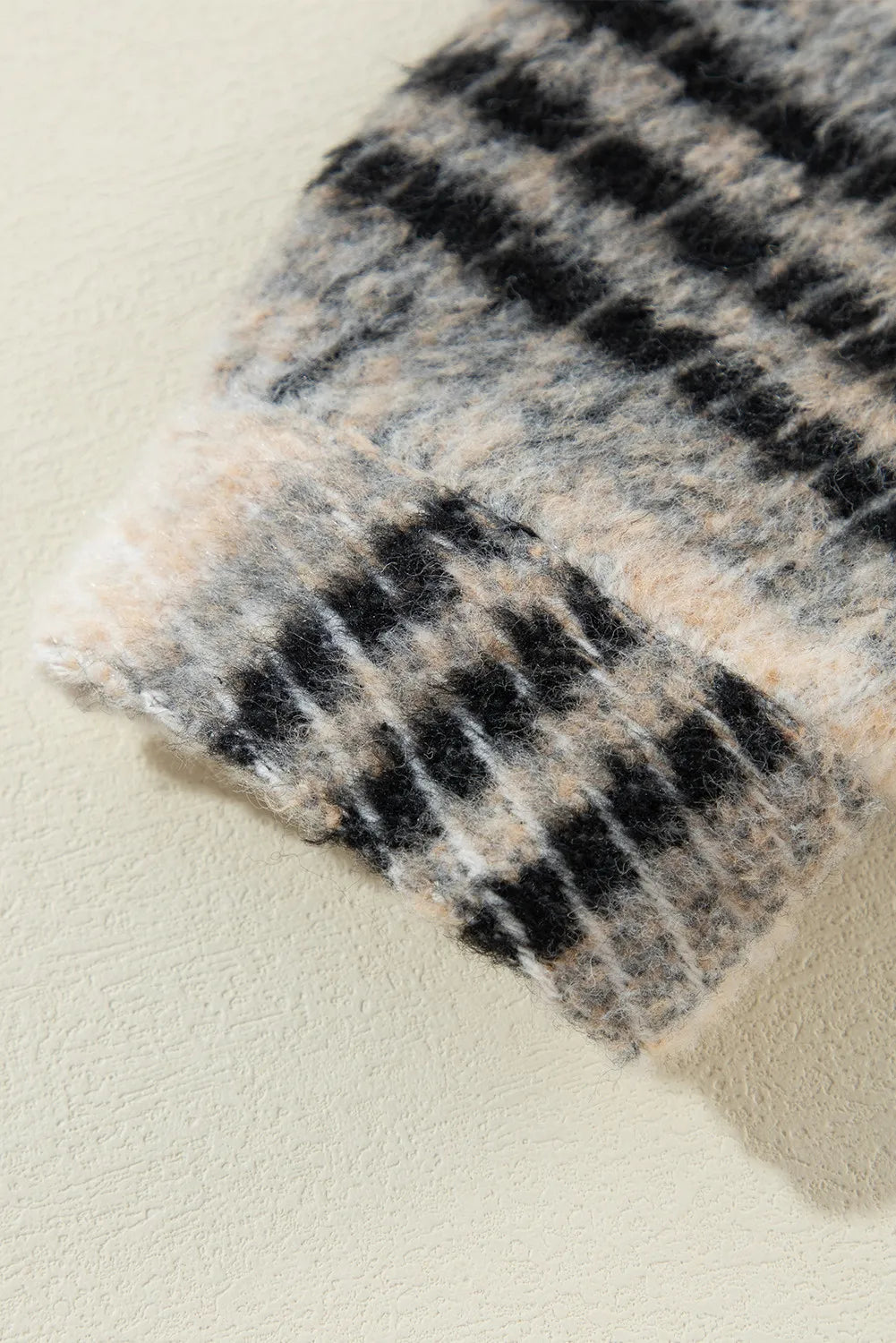 Denim & Plaid Hybrid Hooded Jacket cuff detail with fuzzy black and tan plaid pattern.