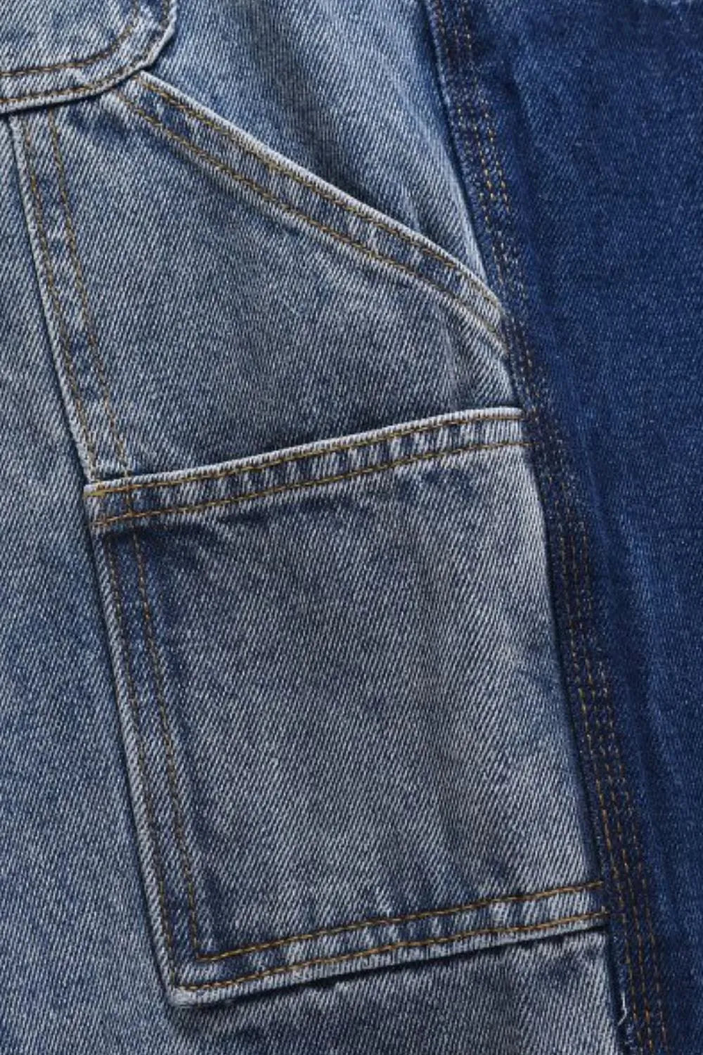 Panelled denim carpenter shorts in dark and medium blue washes with contrast stitching.