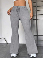 Flare leg lounge trousers in heather gray with drawstring waist and pockets.
