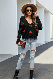 Black acrylic sweater with frayed v-neck and cherry motif