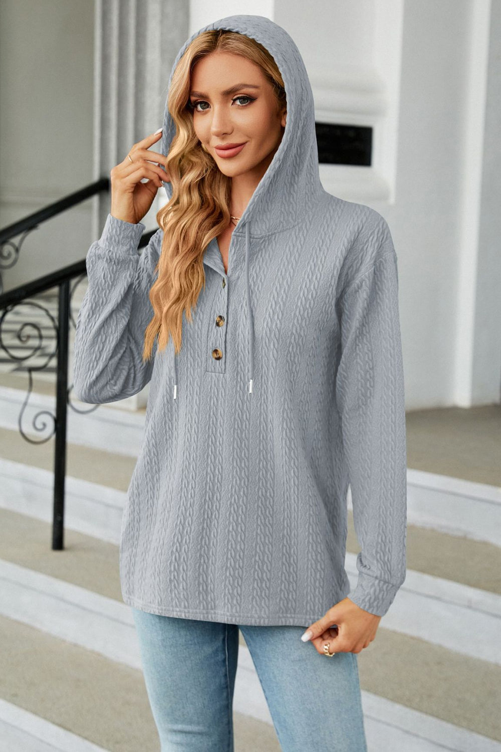 Textured knit henley hoodie in gray with button detail and drawstring hood.
