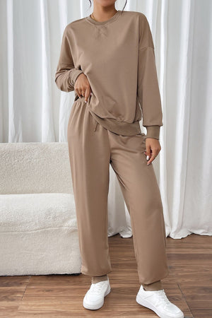 Camel relaxed fit lounge set with crew neck sweatshirt and drawstring pants.