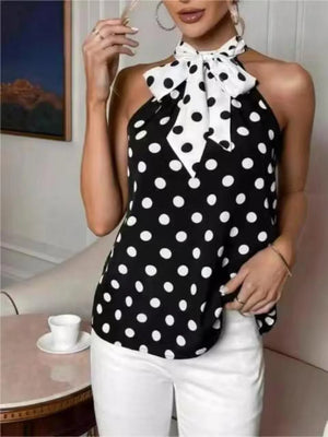 Black polka dot cami with white bow tie neck and halter straps.