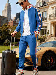 Men's French blue tracksuit with striped sleeves and pants, zip-up jacket and drawstring pants.