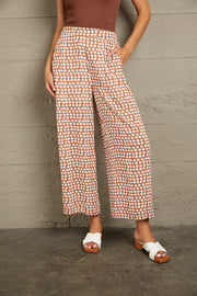 Polka dot culottes in brown with white dots, wide leg, cropped length, high waist.