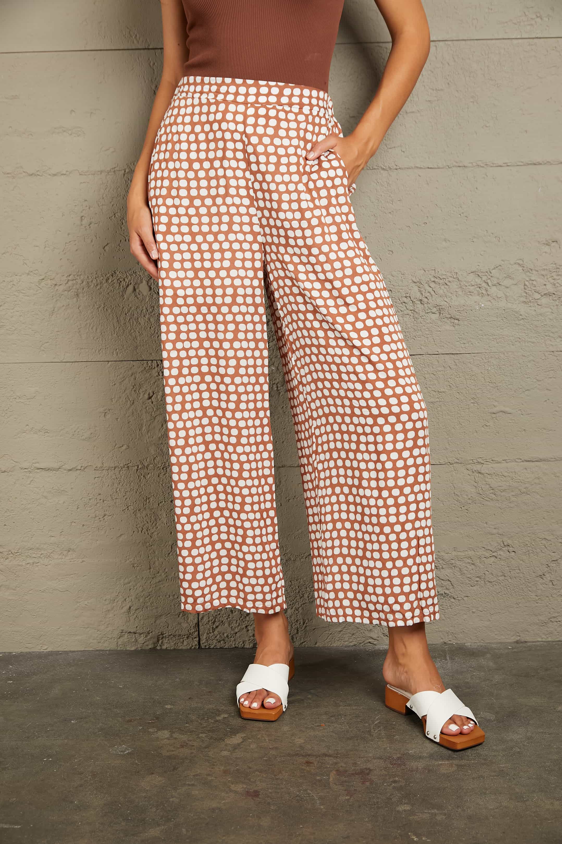 Polka dot culottes in brown with white dots, wide leg, cropped length, high waist.