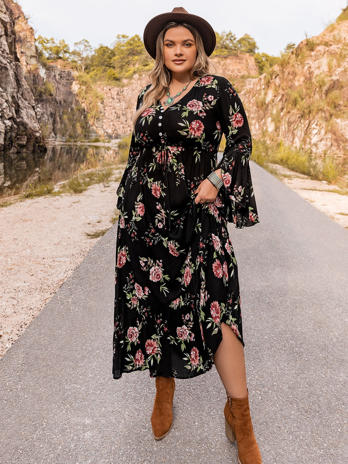 Black floral maxi dress with bell sleeves and a V-neckline.