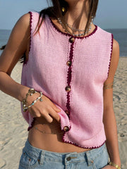 Pink button-down sweater vest with contrast trim and buttons, sleeveless.