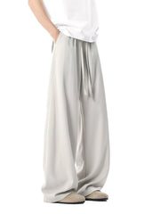 Men's relaxed wide leg sweatpants in light gray with drawstring waist.