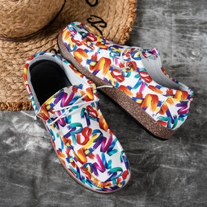 Printed casual slip-on loafers with abstract brushstroke pattern in white with multicolor accents.