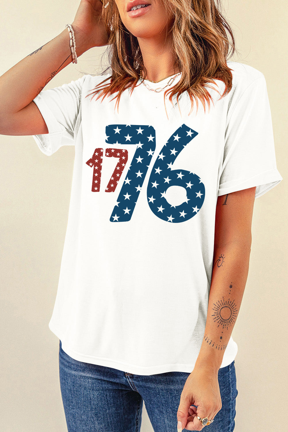 White graphic tee with patriotic 1776 star print and crew neck.