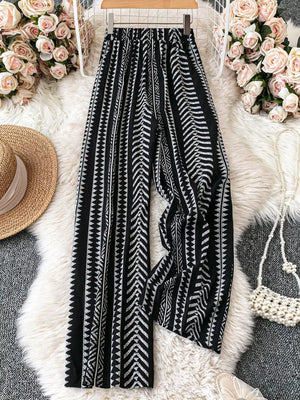 Black geometric print wide-leg maternity pants with adjustable waist and bow detail