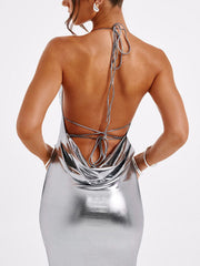 Silver backless ruched maxi dress with a cowl neck and tie back detail.