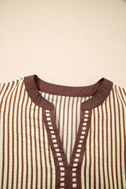 Striped plus size midi dress with brown trim and square detail at V-neck.