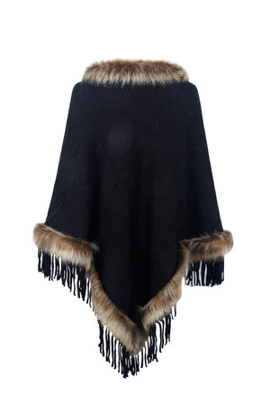 Black textured knit poncho with faux fur trim and fringe detail