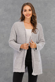 Light gray textured cocoon cardigan with patch pockets and open front.