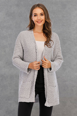 Light gray textured cocoon cardigan with patch pockets and open front.