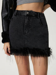 Black denim mini skirt with feather trim and frayed hem