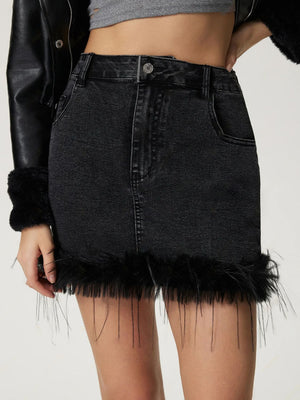 Black denim mini skirt with feather trim and frayed hem