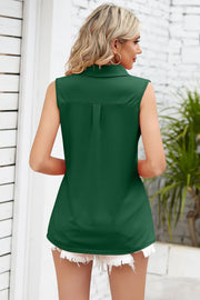 Collared pleat front sleeveless dark green blouse with a relaxed fit.