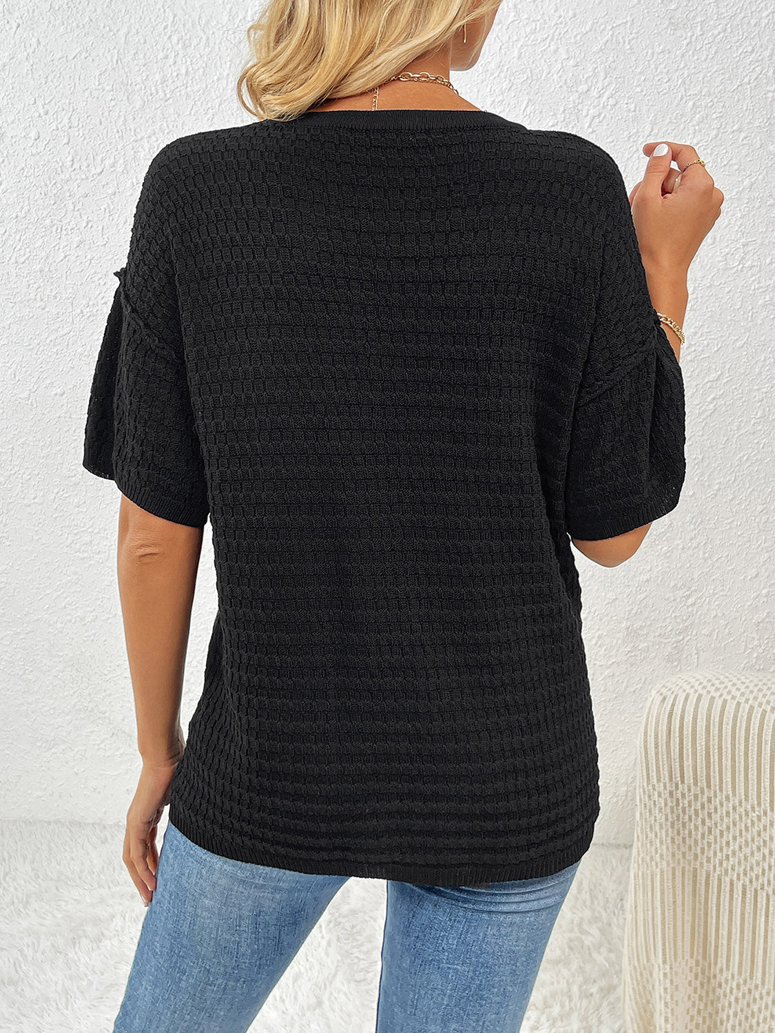 Black textured knit t-shirt with boxy silhouette and short sleeves