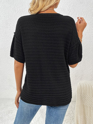 Black textured knit t-shirt with boxy silhouette and short sleeves