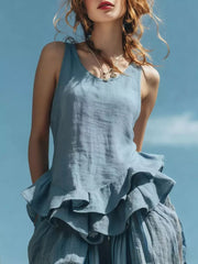 Sky blue sleeveless tank top with ruffled hem detail