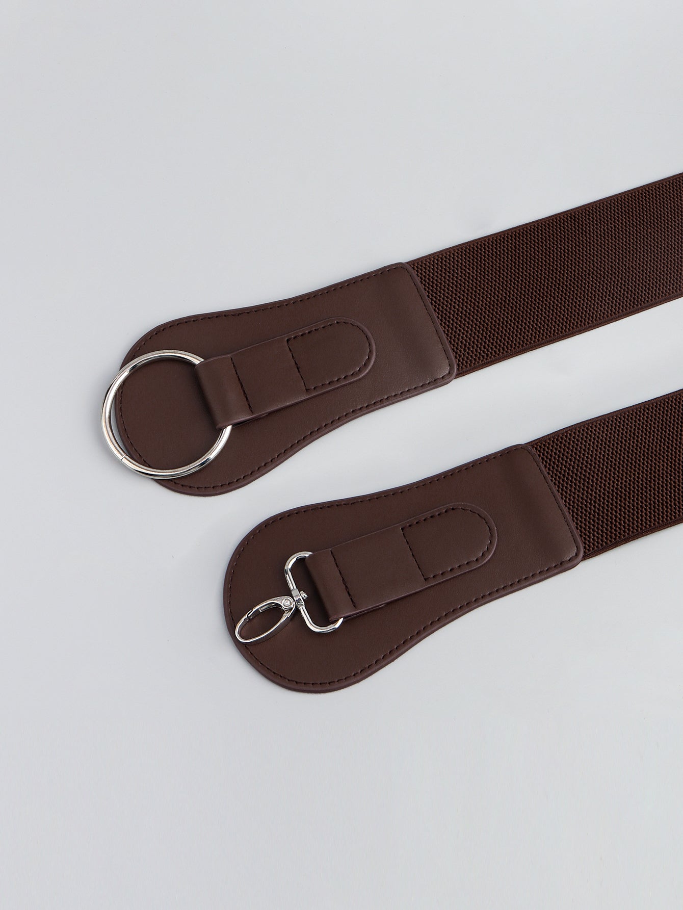 Brown elastic cincher belt with sculpted buckle and alloy clasp detail
