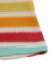 Vibrant striped bodycon midi dress in yellow, orange, red, and teal crochet knit.