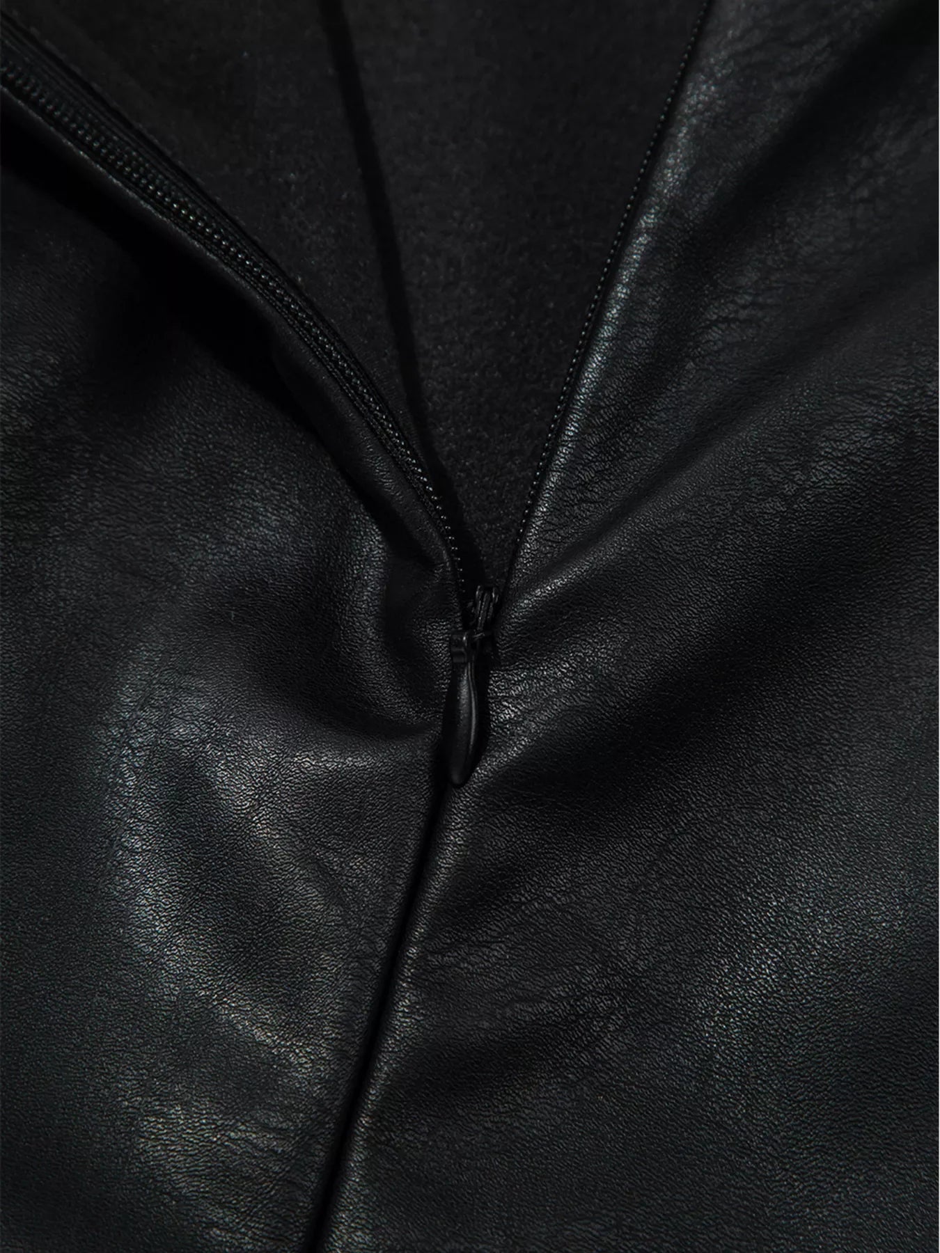 Black vegan leather sleeveless mini dress with zipper detail