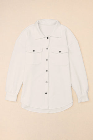 Textured ivory overshirt with patch pockets and button front.