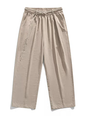 Belted relaxed fit khaki sweatpants with drawstring and buckle closure.