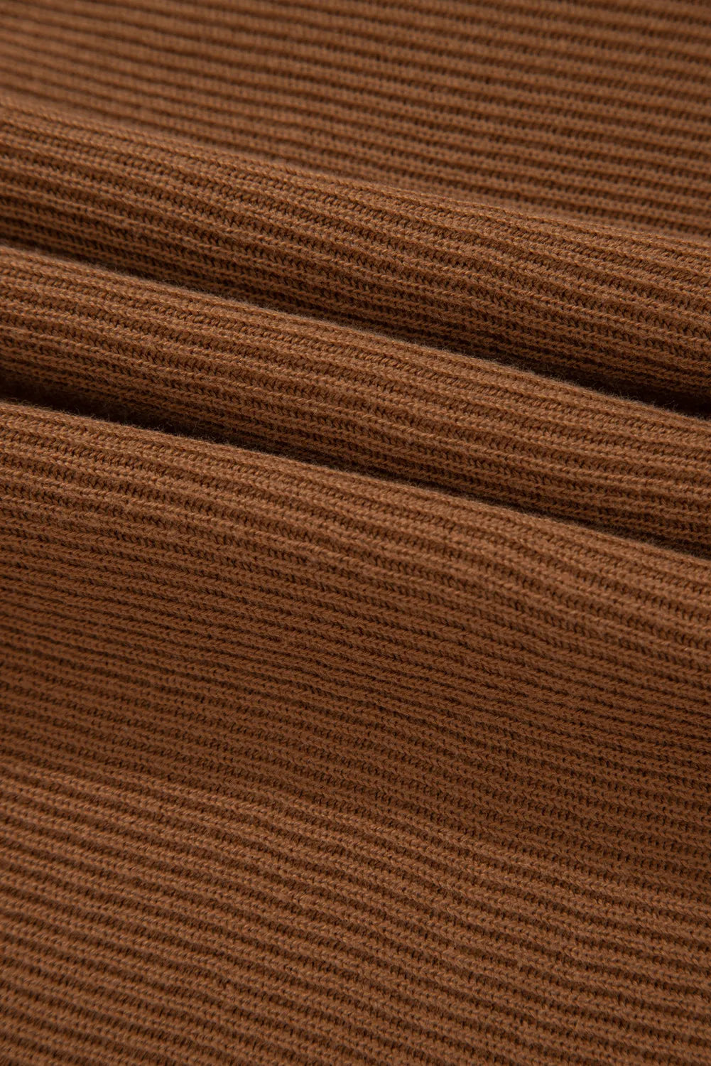 Brown ribbed knit pullover sweater with balloon sleeves.
