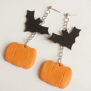 Halloween charm drop earrings with black bats and orange pumpkins.