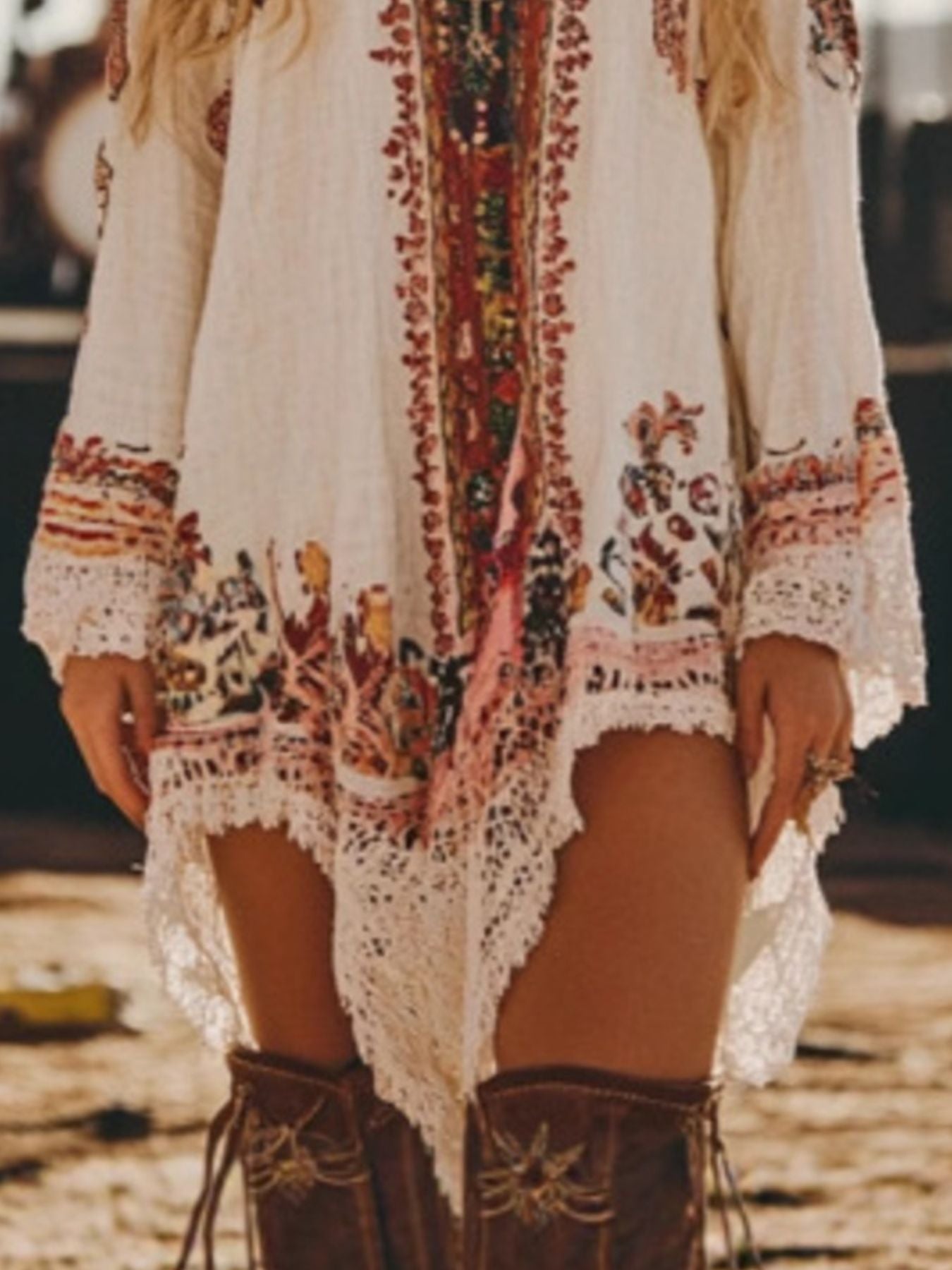 Embroidered mini dress with lace trim and colorful bohemian print.
