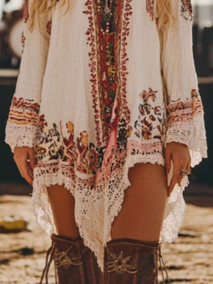 Embroidered mini dress with lace trim and colorful bohemian print.