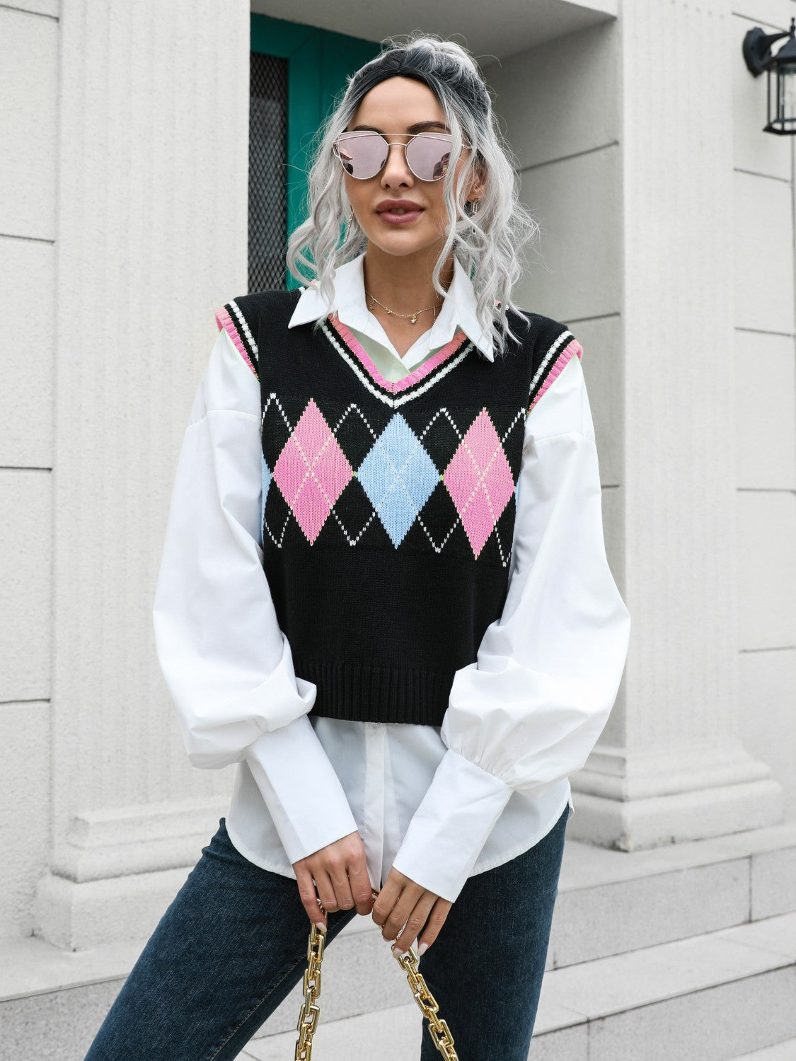 Argyle knit sweater vest with pink and blue diamonds, V-neck, trimmed with pink and white.