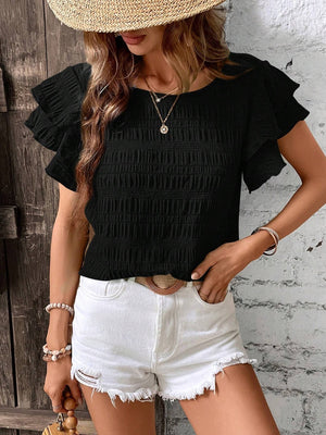 Black smocked blouse with textured ruffle sleeves and a scoop neckline.