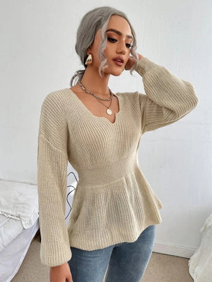 Peplum knit sweater with scallop neckline in caramel, long sleeves, and a fitted waist.