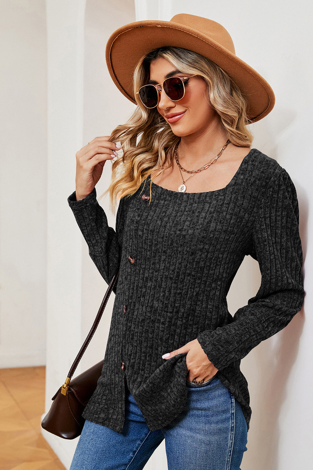 Black ribbed button-down top with asymmetric hem and square neckline
