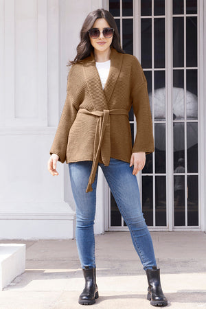 Belted waffle knit cardigan in camel with a shawl collar and tie waist.
